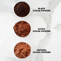 Black Cocoa Powder, Dutch Cocoa Powder, and Natural Cocoa Powder from darkest to lightest in small bowls