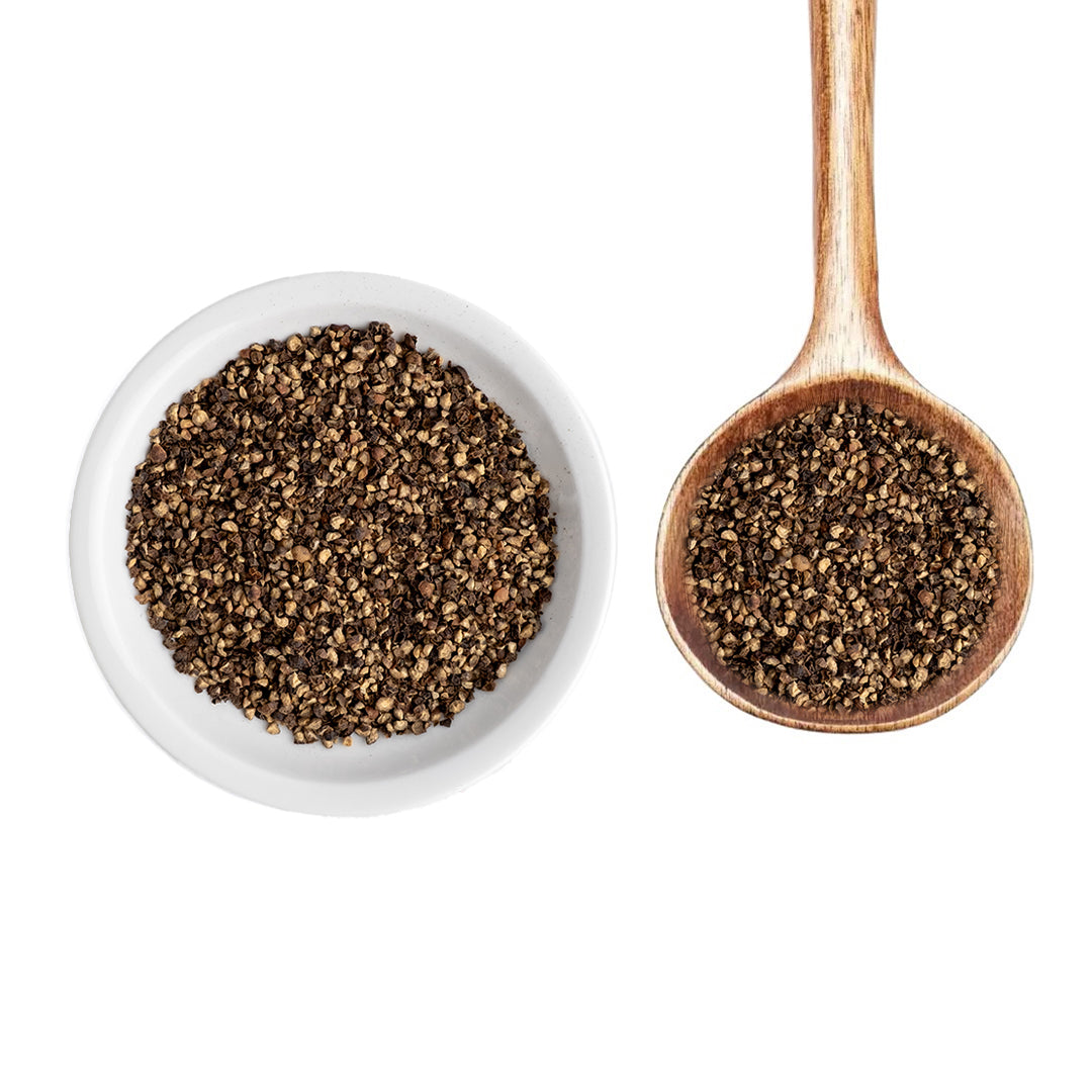 Bourbon Smoked Black Pepper in white bowl and on wood spoon