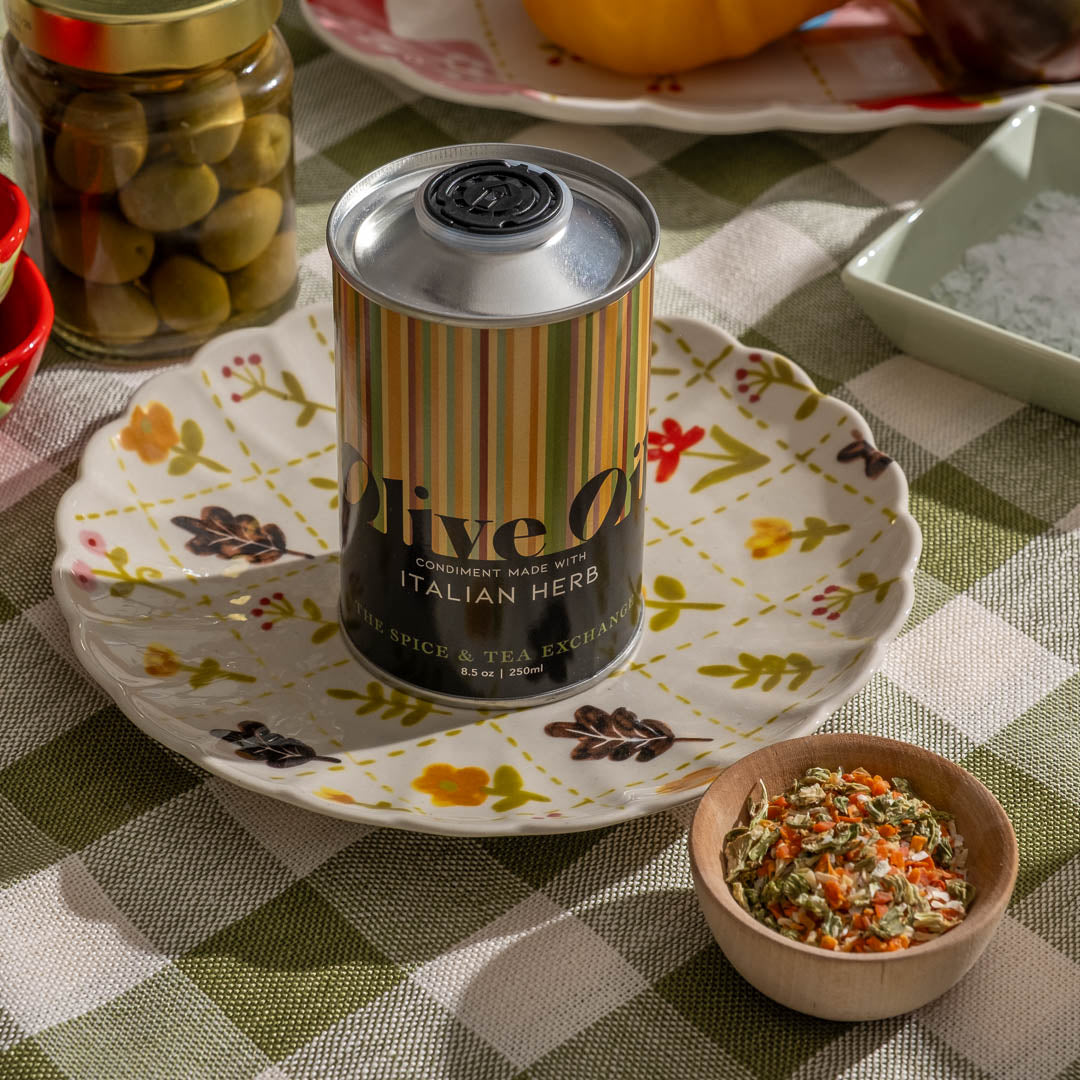 Italian Herb Olive Oil on place next to a bowl of dried vegetables